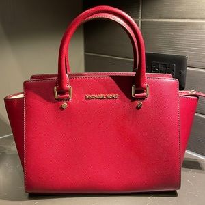 Red Michael Kors purse. Never worn and still has tags